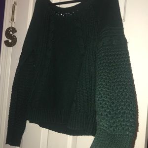 Sweater with hole design in sleeves and back